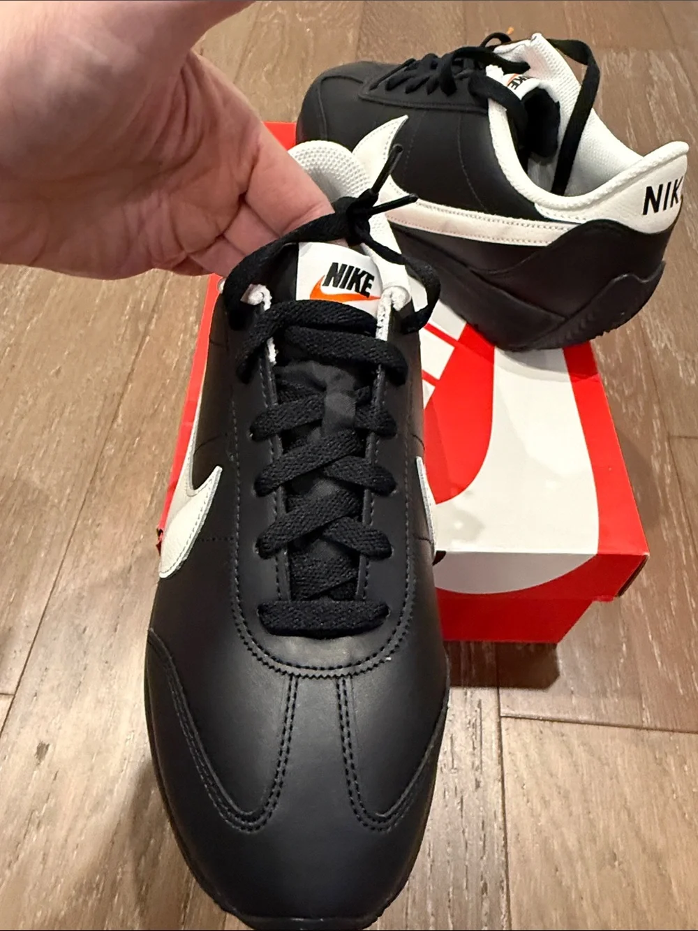 Nike Women's Black with White Swoosh Low-Top Sneakers